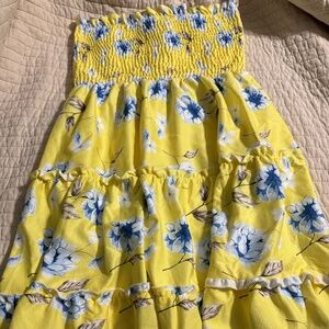 Yellow mini dress with light blue flowers. Never worn.
